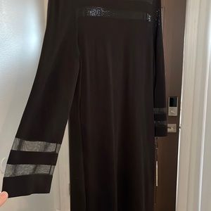 Calvin Klein dress NWT size xl black midi length dress with sheer details.